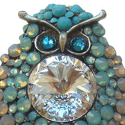 Broche buho azul celeste con brillantes de strass. Mide 5cm de largo x 4cm en su parte más ancha. Trasera en color plata vieja con alfiler y seguro.