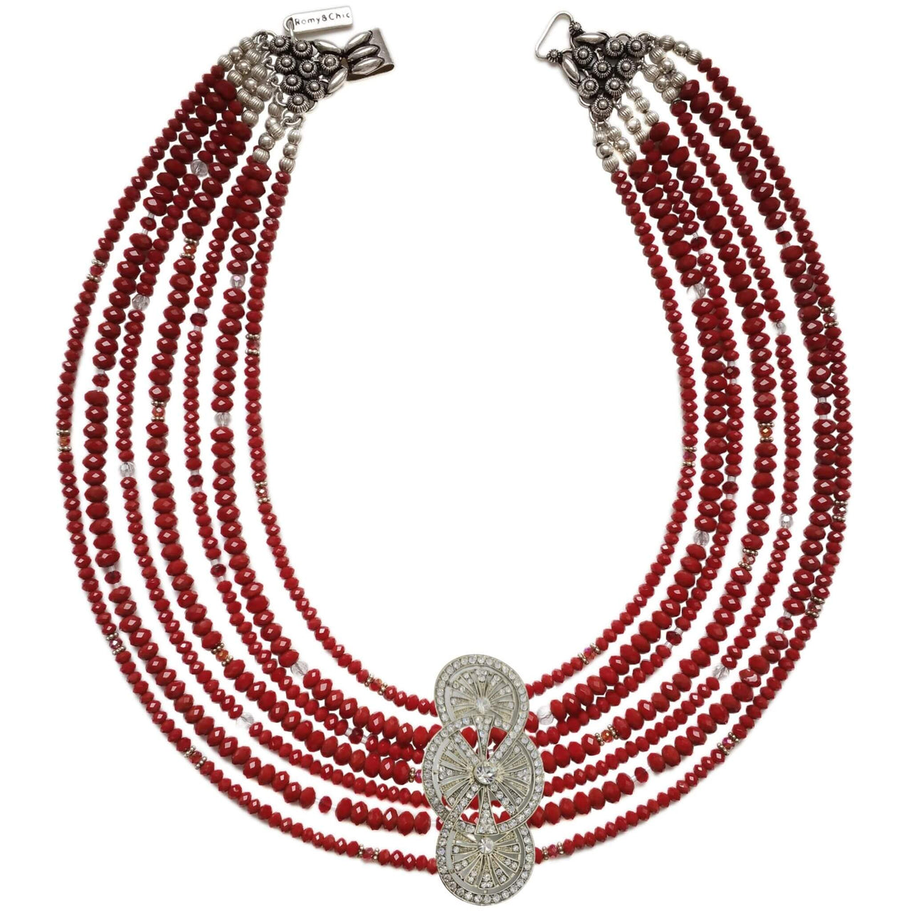 Collar cristal rojo facetado de 6 y 4mm de 7 vueltas. Precioso cierre de plata de ley labrado. Mide 42 cm en su tira más corta. . El broche decorativo es de quita y pon es un regalo incluido en la compra. Dispone de pulsera y pendientes a juego